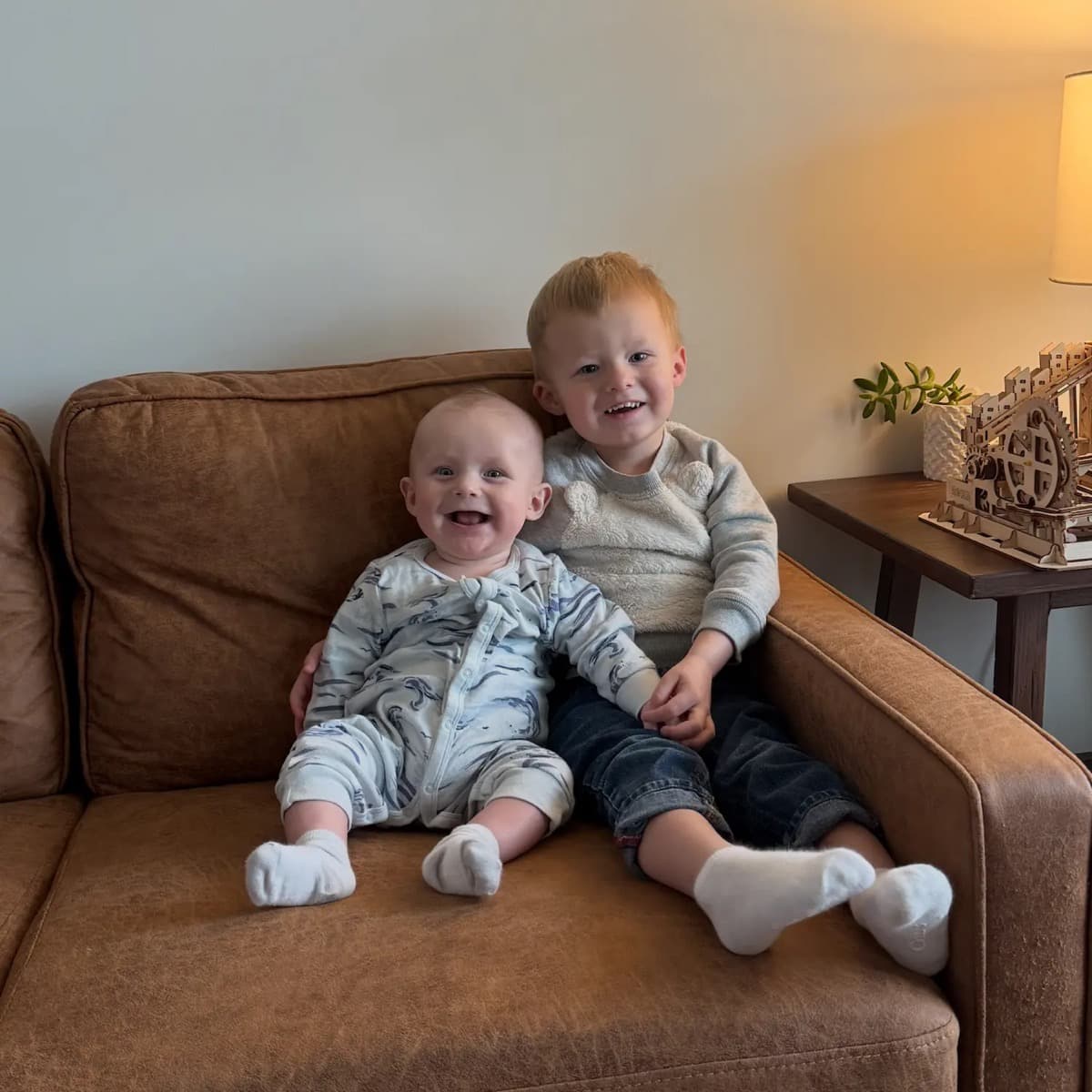 Kyle's two kids sitting together on the couch